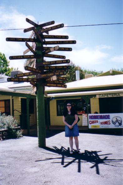 me, with one of the many signs that indicate just how far away they are from.. everywhere else.