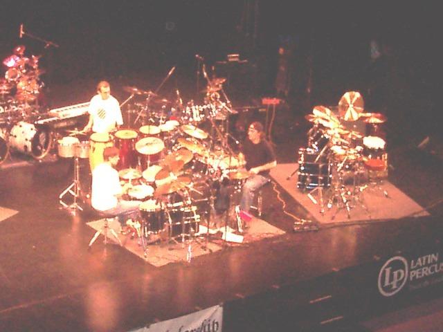 The Academy of Drums instructors in a drum trio.