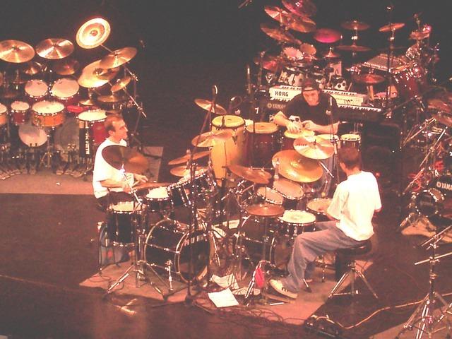 The Academy of Drums instructors in a drum trio.